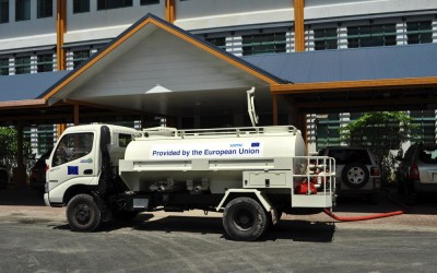 Water tanker filling up from roof run-off from the government building, Funafuti Atoll, Tuvalu